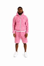 man wearing xxxvi pink shorts set tracksuit with brand logo on a white background thirtysixers 36 thirtysix